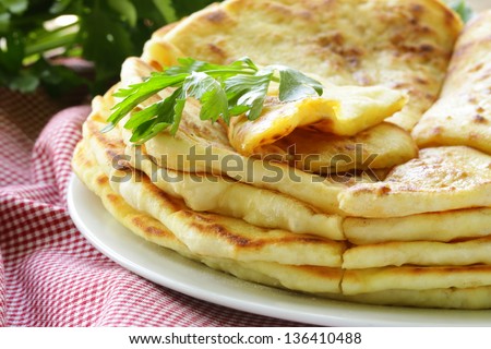 fried bread with butter and parsley - stock photo