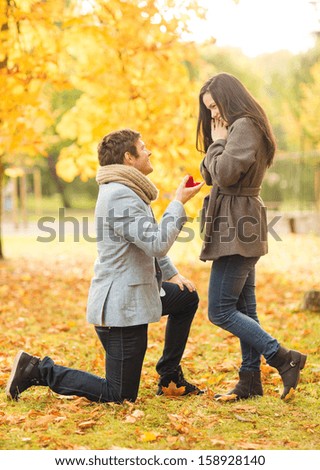http://thumb1.shutterstock.com/display_pic_with_logo/64260/158928140/stock-photo-holidays-love-couple-relationship-and-dating-concept-kneeled-man-proposing-to-a-woman-in-the-158928140.jpg