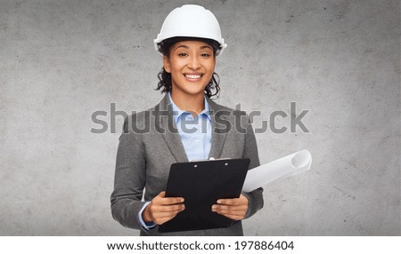 building, developing, construction and architecture concept - smiling businesswoman in white helmet with clipboard and blueprint