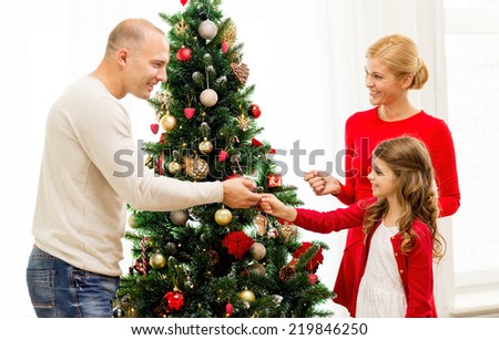 People Decorating For Christmas family xmas winter holidays people concept stock photo 332559449 People Decorating For Christmas family xmas winter holidays people concept stock photo 332559449
