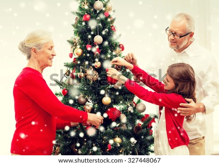 People Decorating For Christmas family decorating tree stock images, royalty-free images & vectors People Decorating For Christmas family decorating tree stock images, royalty-free images & vectors