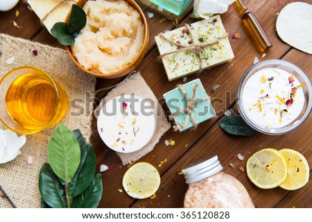 close up of body care cosmetic products on wood