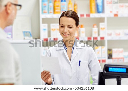 medicine, pharmaceutics, health care and people concept - pharmacist reading prescription and senior man at drugstore cash register