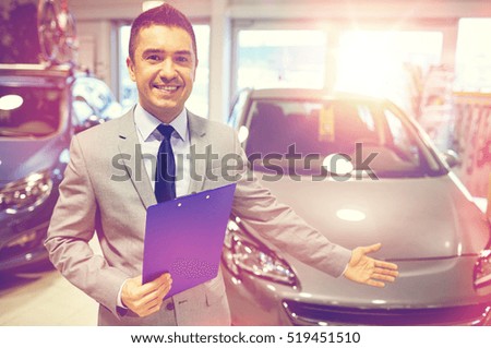 auto business, car sale, consumerism and people concept - happy man at auto show or salon