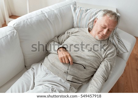 stock-photo-old-age-rest-comfort-and-people-concept-senior-man-sleeping-on-sofa-at-home-549457918.jpg