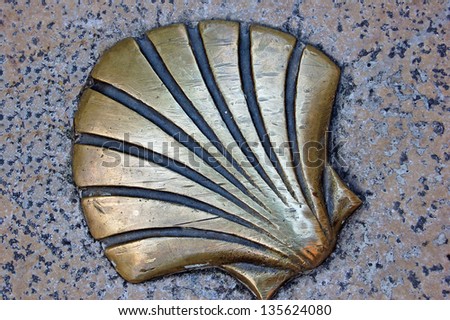 One of the pilgrim's shells that marks the ground in the 