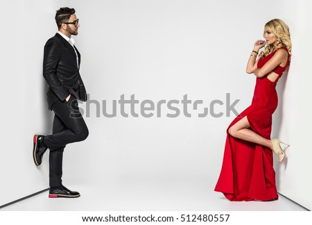 young fashion couple on a white background in studio