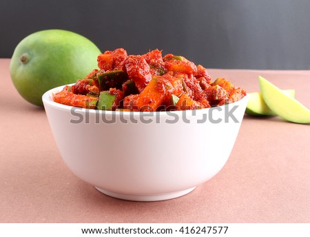 Raw mango pickle in a bowl.