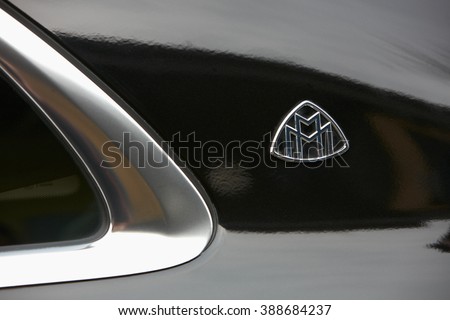 MILAN - FEBRUARY 24: Black Maybach luxury car logo before Gucci fashion show, Milan Fashion Week Day 1 street style on February 24, 2016 in Milan.