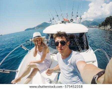 https://thumb1.shutterstock.com/display_pic_with_logo/666661/575452318/stock-photo-couple-resting-on-a-yacht-at-sea-luxury-holiday-vacation-575452318.jpg