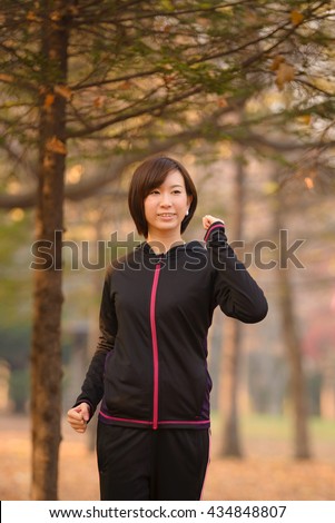 https://thumb1.shutterstock.com/display_pic_with_logo/679093/434848807/stock-photo-young-asian-woman-walking-in-autumn-forest-434848807.jpg