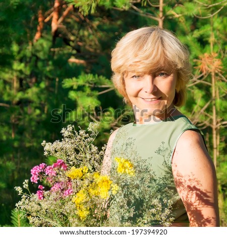 https://thumb1.shutterstock.com/display_pic_with_logo/683221/197394920/stock-photo-woman-with-bouquet-of-wild-flowers-on-walk-in-summer-wood-197394920.jpg