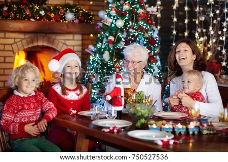 Family Children Eating Christmas Dinner Fireplace Stock ...