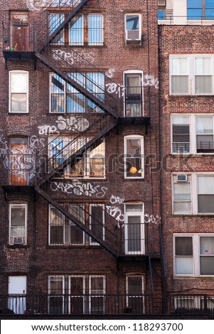 Apartment Building Fire Escape Ladder new york fire escape stock images, royalty-free images & vectors Apartment Building Fire Escape Ladder new york fire escape stock images, royalty-free images & vectors
