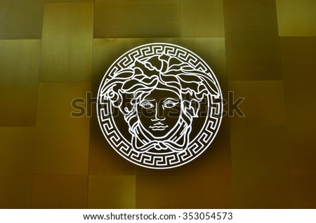 SINGAPORE - NOVEMBER 18, 2015: close us shot of Versace logo on the wall. Versace, is an Italian fashion company and trade name founded by Gianni Versace in 1978