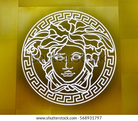 SINGAPORE - NOVEMBER 18, 2015: close us shot of Versace logo on the wall. Versace, is an Italian fashion company and trade name founded by Gianni Versace in 1978