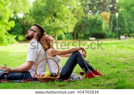 https://thumb1.shutterstock.com/display_pic_with_logo/692005/454705834/stock-photo-couple-sitting-on-a-picnic-blanket-both-pensive-enjoying-the-peace-and-nature-454705834.jpg