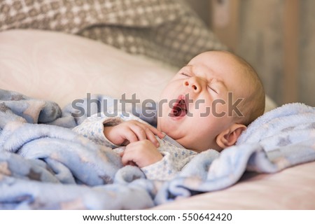 Cute baby yawning before sleep