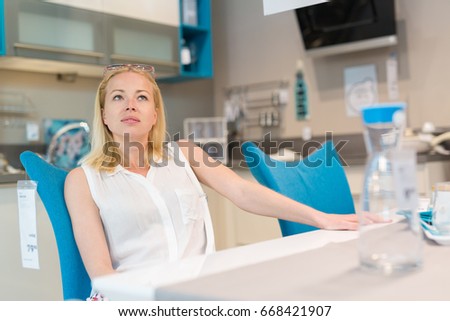 caucasian woman shopping for furniture recliner and home decor in store lady sitting on - Woman Home Decorating caucasian woman shopping for furniture recliner and home decor in store lady sitting on - Woman Home Decorating