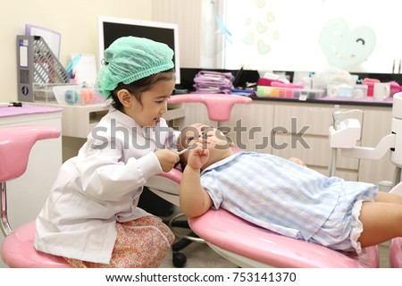 Asian girl group use dentist equipment to clean tooth for prevent toothache and good healthy concept. 