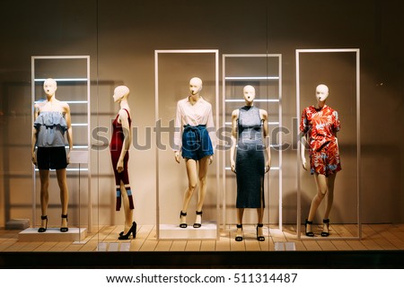 Five Mannequins Standing In Store Window Display Of Womens Casual Clothing Shop Shopping Mall Five Mannequins Standing In Store Window Display Of Womens Casual Clothing Shop Shopping Mall