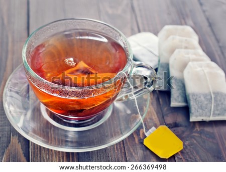 tea in glass cup on the wooden table