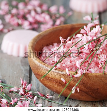 Spa with pink salt, flowers and soap, selective focus and square image