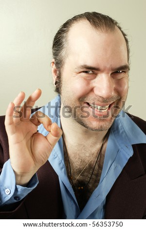 stock-photo-a-sleazy-car-salesman-con-man-retro-suit-wearing-man-with-evil-grin-and-making-a-hand-sign-56353750.jpg