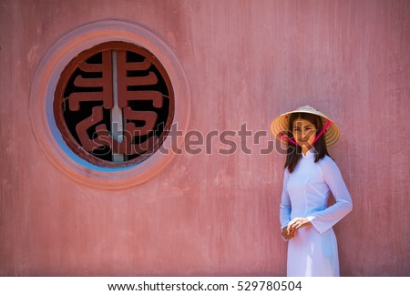 vietnam girl walk in Thien Mu temple hue town