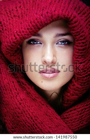 https://thumb1.shutterstock.com/display_pic_with_logo/713761/141987550/stock-photo-young-pretty-woman-in-sweater-and-scarf-all-over-her-face-141987550.jpg