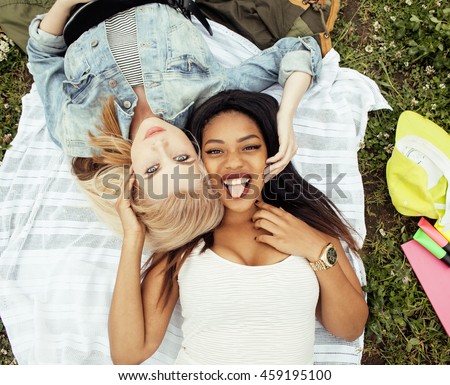 https://thumb1.shutterstock.com/display_pic_with_logo/713761/459195100/stock-photo-two-young-pretty-teenager-girls-best-friends-laying-on-grass-making-selfie-photo-having-fun-459195100.jpg