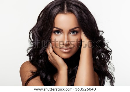 Portrait of a beautiful brunette on white background
