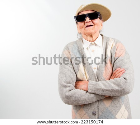 stock photo funny grandma s studio portrait wearing eyeglasses and baseball cap isolated on white 223150174