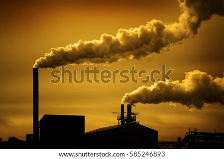 Pollution and smoke from chimneys of factory or power plant
