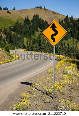 Mountain Road Sign Warning Stock Photos, Royalty-Free Images & Vectors ...