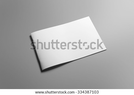 Blank landscape brochure magazine isolated on cardboard background, with clipping path, changeable background