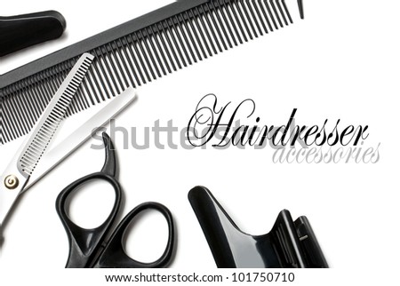 scissors and comb on a white background