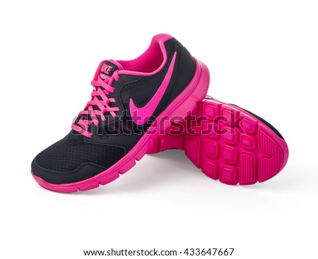 Chisinau, Moldova- May 27, 2015: Nike lady's - women's running shoes - sneakers - trainers, in gray and pink, showing the Nike swoosh logo and sole - illustrative editorial