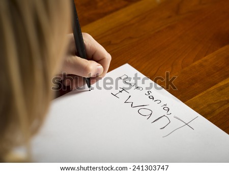 A child writing a letter to Santa before Christmas.