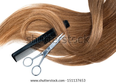 Professional hairdresser scissors and comb on white background