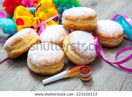 Krapfen or donuts with jam and icing sugar