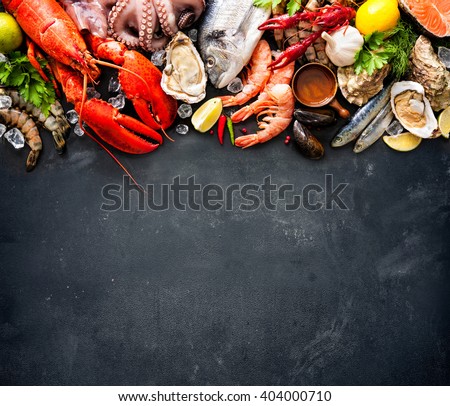Shellfish plate of crustacean seafood with fresh lobster, mussels, oysters as an ocean gourmet dinner background