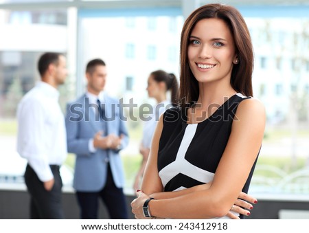 Face of beautiful woman on the background of business people