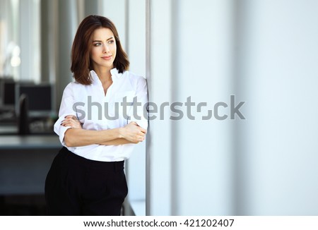 Modern business woman in the office with copy space