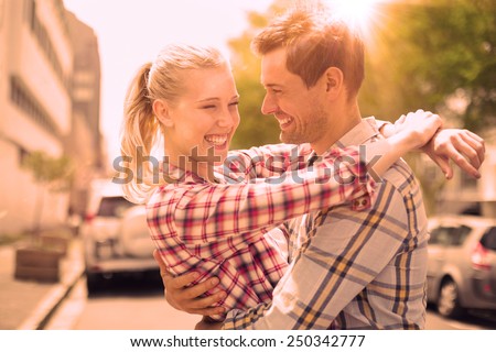 https://thumb1.shutterstock.com/display_pic_with_logo/76219/250342777/stock-photo-couple-in-check-shirts-and-denim-hugging-each-other-on-a-sunny-day-in-the-city-250342777.jpg
