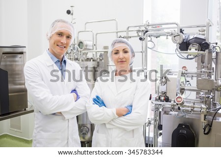 Scientists working with large vats in the lab