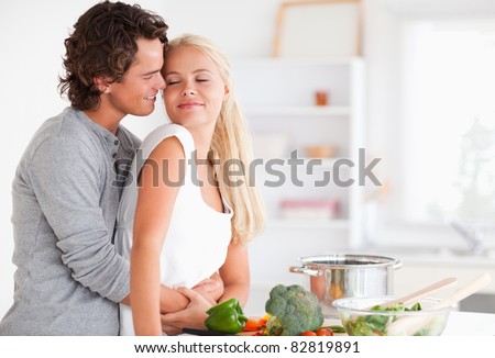https://thumb1.shutterstock.com/display_pic_with_logo/76219/76219,1313070391,208/stock-photo-cute-couple-hugging-while-cooking-in-their-kitchen-82819891.jpg