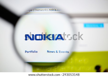 LISBON, PORTUGAL - June 6, 2015. Photo of NOKIA homepage on a monitor screen through a magnifying glass.