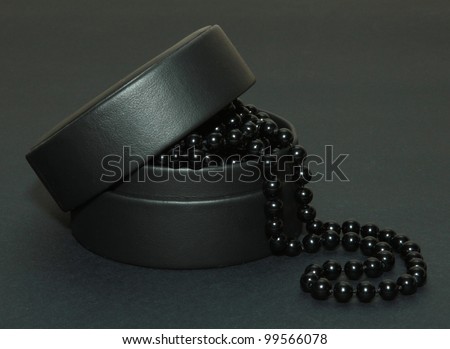 Black pearls on a black background