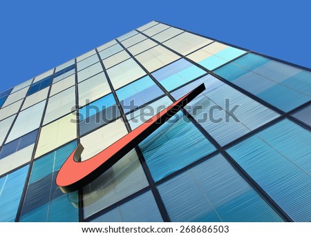 BEIJING-DECEMBER 19, 2013. Nike logo on colorful facade. Sportswear has been increasingly popular in China, driven by booming economy and rising incomes. Last years the market has grown 30% annually.